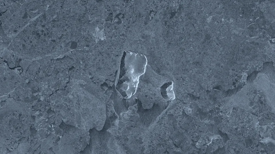 The same area on 4 March 2025, with the islands surrounded by fractured pack ice.